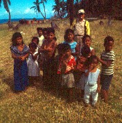 priest with children on Agrigan